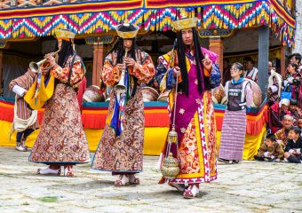 Monks playing traditional music befor Tshechu dance - bhutan